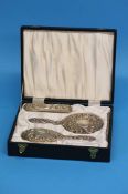 A cased silver 3 piece dressing table set