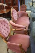 A Victorian walnut framed settee and a pair of chairs