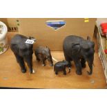 4 carved hardwood elephants