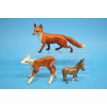 A Beswick standing fox, a Beswick calf and a small