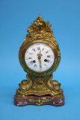 A French ormolu mantle clock on a marble base