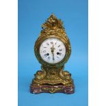 A French ormolu mantle clock on a marble base