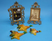 A Gilt easel mirror, a photograph frame and a set