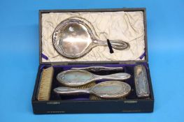 A silver six piece boxed dressing table