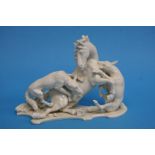 A Continental porcelain group of a horse being att