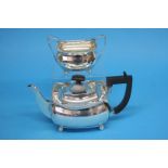 A silver tea pot supported on ball feet and a silver sugar bowl, Sheffield 1924, makers mark S