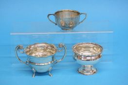 Two silver two-handled bowls and another silver pedestal bowl, weight 9.9oz/308.7gm