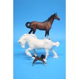 Two Beswick horses and a foal