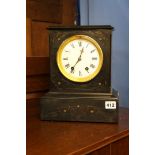 A black marble mantle clock