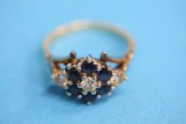 An 18ct gold diamond three stone ring set with six sapphires