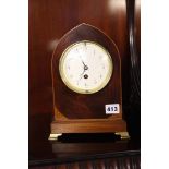 Mahogany mantle clock on brass bracket feet