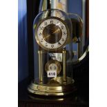 A ' President' Electric clock under glass dome