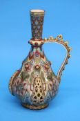 A Zsolnay ewer with pierced looped handle, baluste