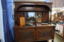 A large carved oak mirror back sideboard 183cm wide