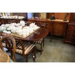 A reproduction mahogany dining room suite