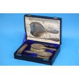 A boxed seven piece silver dressing table set