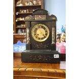 A black marble mantle clock