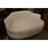 A white leather and upholstered corner settee