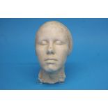 A plaster death mask of a lady. 27cm length