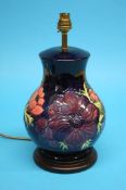 A large Moorcroft table lamp of baluster form on a