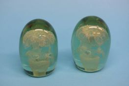 A pair of Victorian glass dumps, each with two tie
