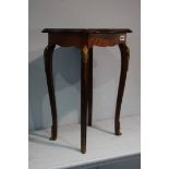 Continental kingwood occasional table with gilt metal mounts