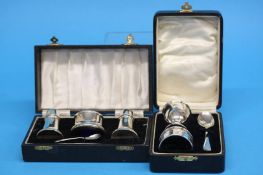 A silver 4 piece condiment set and a cased 3 piece silver christening set 3.0oz/95.1gm