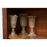 A garniture of three glass vases