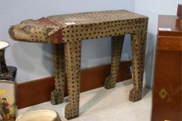 Carved wood stool in the form of a leopard