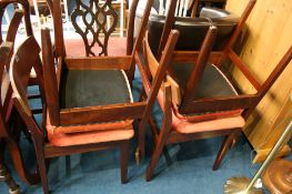 Four teak dining chairs