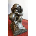 Bronze effect figure of a chimp contemplating a sk
