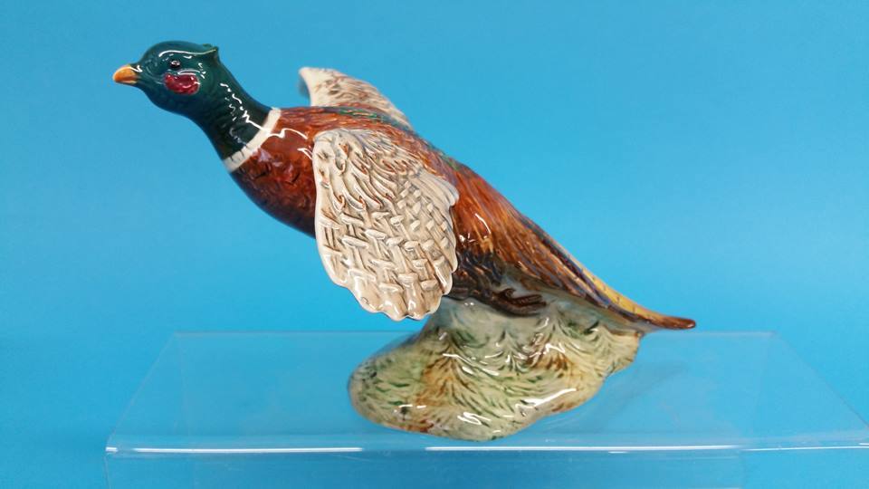 A Beswick Pheasant, black printed mark, numbered 8