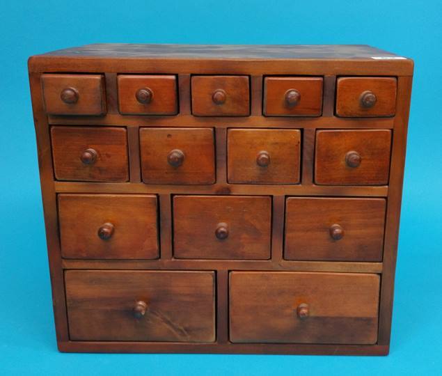 A modern miniature chest of drawers