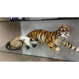 Ceramic tiger and a cat