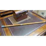 A Chinse bamboo walking cane with silver metal pom