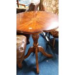 A reproduction mahogany occasional table with shap