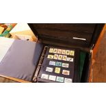 2 Folders of stamps in a brief case