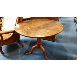 An oak circular tripod table. 87 cm diameter