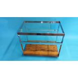 A Merrow Associates three tier drinks trolley with clear glass and chrome supports and rosewood