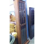 A hardwood CD cabinet with brass inlay