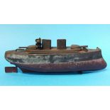 A tinplate model battle ship, stamped 'Made in Eng