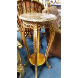 A pair of gilt and circular marble top stands