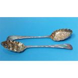 A pair of silver berry spoons, various dates, weig