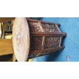 A carved Burmese circular and brass inlaid table. 60 cm diameter