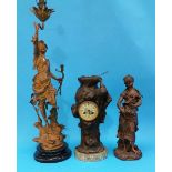 A Spelter clock group, a Spelter figural table lam