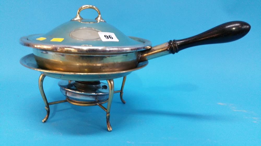 A silver plated food warmer.