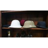 Various hats including 2 pith helmets