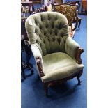 A Victorian green buttoned back armchair