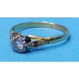 An 18ct gold diamond ring, the central diamond approx. 0.2carat