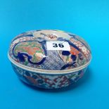 A small Japanese Imari circular dish and cover, 13